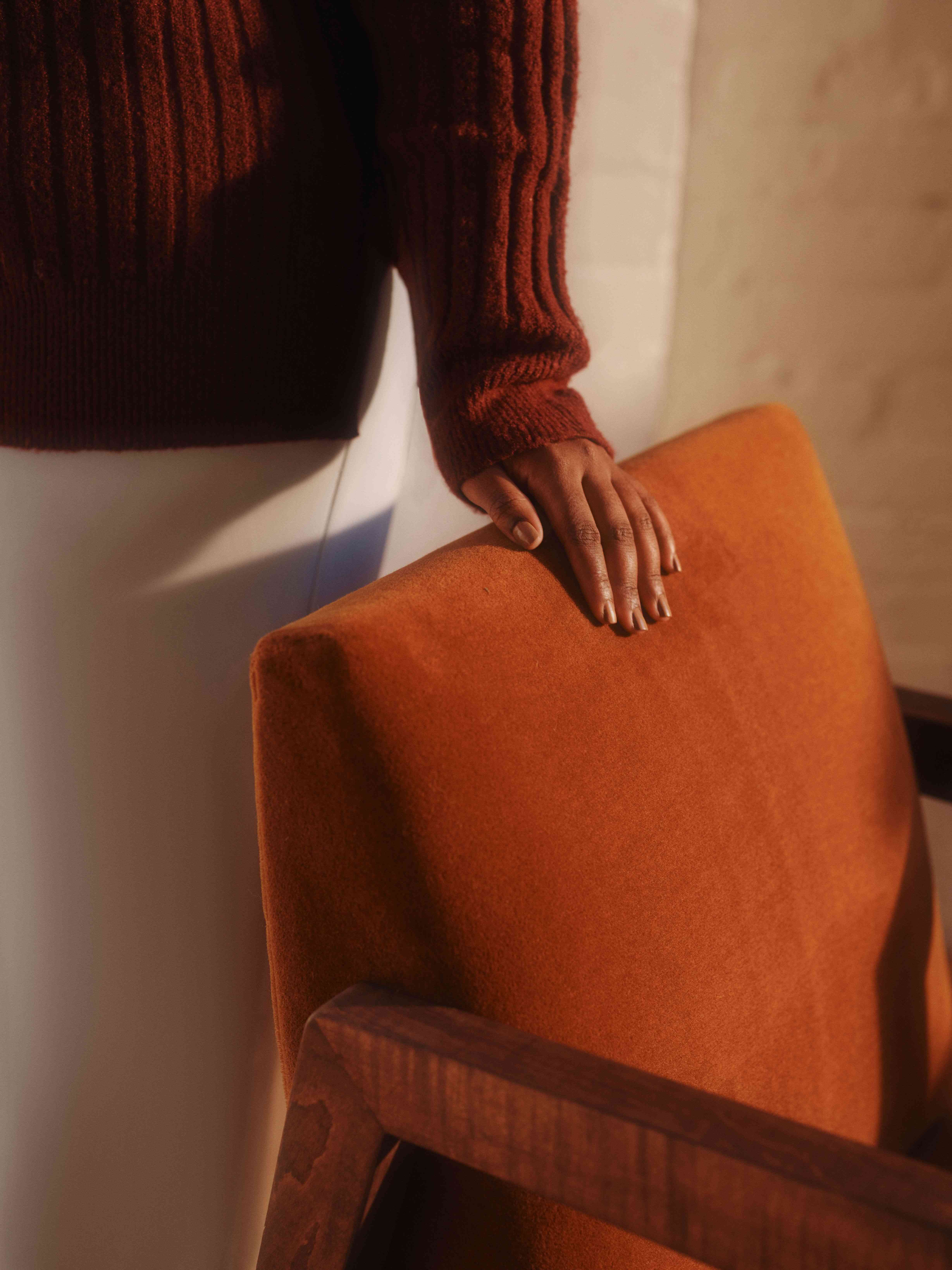 Patient touching chair